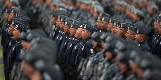 Officers belonging to Mexico's newest police force, known as the gendarmerie, take the service vow during the launching ceremony for the new force at the Federal Police headquarters in Mexico City.