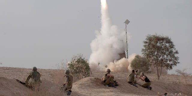 An Israeli Iron Dome missile is launched near the city of Be'er Sheva, southern Israel, to intercept a rocket fired from Gaza Saturday, Nov. 17, 2012. Israel bombarded the Hamas-ruled Gaza Strip with nearly 200 airstrikes early Saturday, the military said, widening a blistering assault on Gaza rocket operations to include the prime minister's headquarters, a police compound and a vast network of smuggling tunnels. (AP Photo/Ahikam Seri)