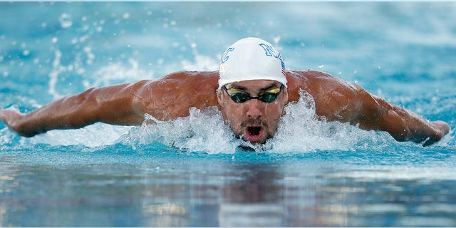 Michael Phelps swims in the 200-meter individual medley final during the Santa Clara International Grand Prix swim meet in Santa Clara, Calif., Sunday, June 22, 2014. Michael Phelps finished in third place. (AP Photo/Tony Avelar)