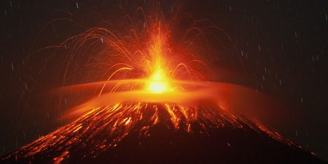 File photo: Mount Slamet spews lava and gas during its eruption as seen from Pandansari village in Brebes, Central Java, Indonesia, Thursday, Sept. 18, 2014. (AP Photo/Idhad Zakaria)