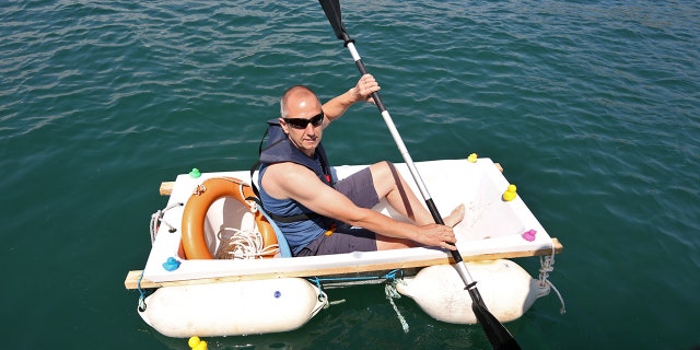 Iain Bevan, 51, a plumber from Devon in southwest England, spent two-and-a-half hours rowing across Tor Bay in an effort to raise more than $13,000.