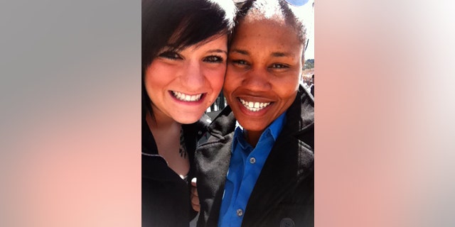 In this undated photograph made available by Allison Hanson, Hanson, left, poses with her partner, Sgt. Karen Alexander. Alexander, who is stationed at Fort Bragg, N.C., married Hanson in Washington.