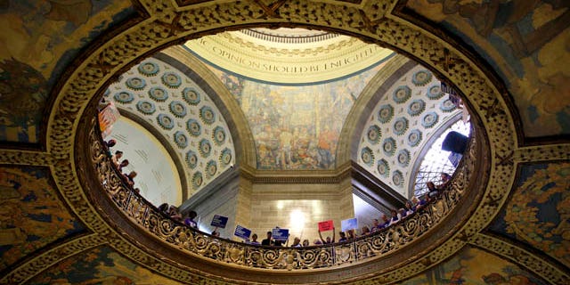 September 10, 2014: Abortion rights activists hold signs inside the Missouri Capitol in Jefferson City, Mo. (AP Photo/Jeff Roberson)