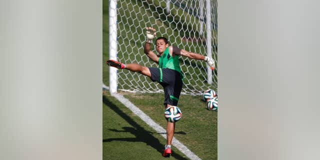 Mexico's national soccer player Javier Hernandez kicks the ball during a training session of Mexico in Santos, Brazil, Sunday, June 8, 2014. Mexico plays in group A of the 2014 soccer World Cup. (AP Photo/Eduardo Verdugo)