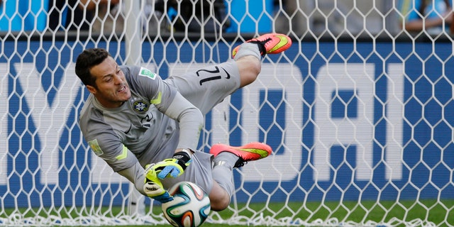 June 28, 2014 - Brazil's goalkeeper Julio Cesar makes a save during a penalty shootout during the World Cup match between Brazil and Chile, Mineirao Stadium in Belo Horizonte, Brazil.