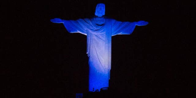 Christ the Redeemer statue is lit with the Argentina team's colors as part of soccer the World Cup, in Rio de Janeiro, Brazil, Saturday, July 12, 2014. Argentina will face Germany for the final match of the world tournament. (AP Photo/Leo Correa)