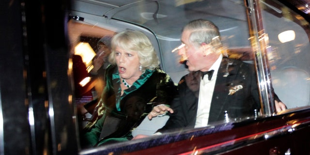 Dec. 9: Britain's Prince Charles and Camilla, Duchess of Cornwall, react as their car is attacked by angry protesters in London.
