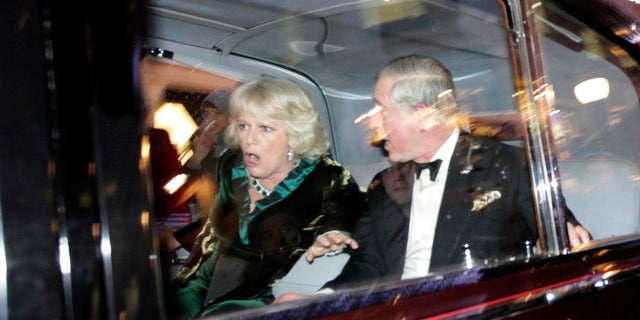 Dec. 9: Britain's Prince Charles and Camilla, Duchess of Cornwall, react as their car is attacked by angry protesters in London.