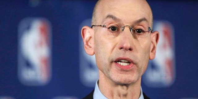 NBA Commissioner Adam Silver addresses the media during a news conference, in New York, Tuesday, April 29, 2014. Silver announced that he is banning Los Angeles Clipper owner Donald Sterling for life from the Clippers organization over racist comments in a recording. (AP Photo/Richard Drew)