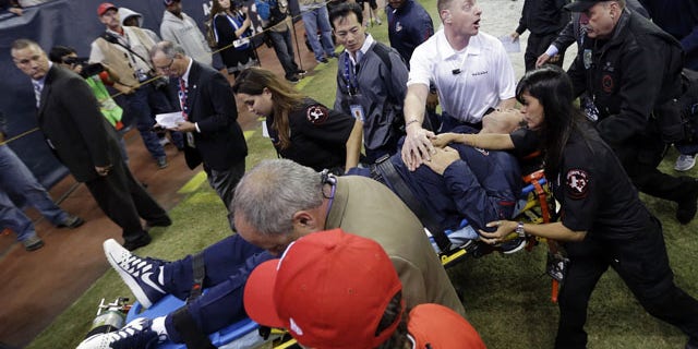 Houston Texans head coach Gary Kubiak is taken off the field on a stretcher during the second quarter of an NFL football game against the Indianapolis Colts, Sunday, Nov. 3, 2013, in Houston. (AP Photo/David J. Phillip)