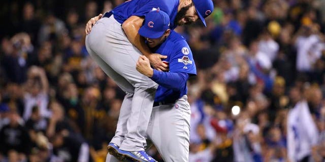 Oct. 7, 2015: Chicago Cubs first baseman Anthony Rizzo, right, holds Chicago Cubs starting pitcher Jake Arrieta after they defeated the Pittsburgh Pirates in the National League wild card baseball game 4-0 in Pittsburgh. The Cubs advance to play the St. Louis Cardinals in the National League Division Series.(AP Photo/Gene J. Puskar)