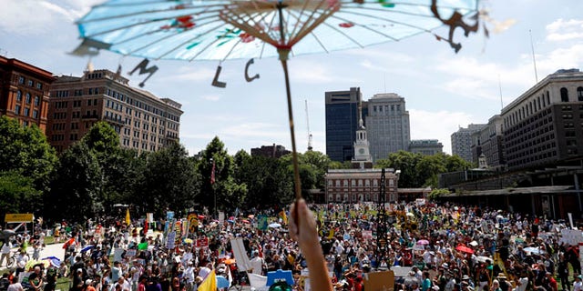 Protesters gather during a demonstration at Liberty Square on Sunday, July 24, 2016, in Philadelphia.
