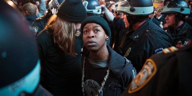 A demonstrator is arrested on Tuesday, Nov. 25, 2014, in New York.
