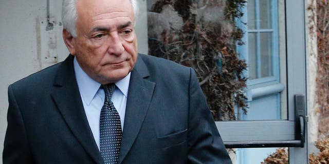 Former International Monetary Fund boss Dominique Strauss-Kahn leaves his hotel in Lille, northern France, Wednesday, Feb. 11, 2015 as he goes on trial for sex charges at a court. Strauss-Kahn sat nonchalantly with folded-arms and stretched legs Tuesday, before telling a French court he was completely unaware that women who participated in orgies at luxury hotels in Paris and Washington were prostitutes. (AP Photo/Christophe Ena)