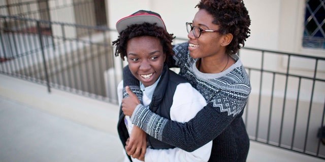 Jan. 25, 2015: Shanté Wolfe, left and Tori Sisson embrace near the Montgomery County Courthouse, where they plan to stay overnight to be married Monday morning. A federal judge has stayed her order overturning Alabama's gay marriage ban for two weeks. (AP Photo/Brynn Anderson)