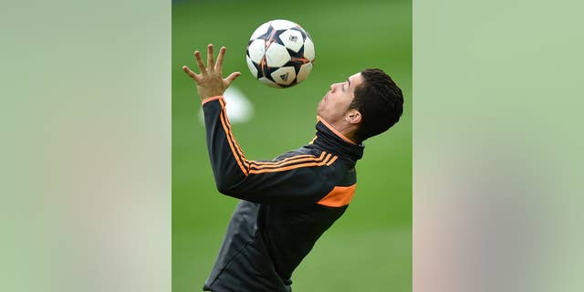 Real's Cristiano Ronaldo controls the ball during a training session prior the UEFA Champions League second leg soccer match between Borussia Dortmund and Real Madrid in Dortmund, Monday, April 7, 2014. Ronaldo had to break off the training. (AP Photo/Martin Meissner)