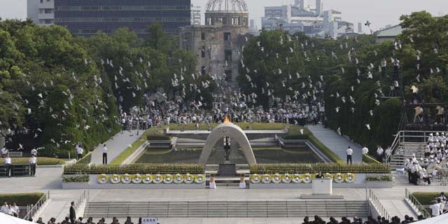 August 6, 2013: Doves fly over the cenotaph dedicated to the victims of the atomic bombing at the Hiroshima Peace Memorial Park during the ceremony to mark the 68th anniversary of the bombing, in Hiroshima, western Japan. (AP Photo)