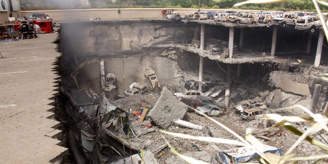Sept. 26, 2013 - Collapsed upper car park of the Westgate Mall in Nairobi, Kenya. Working near bodies crushed by rubble in a bullet-scarred, scorched mall, FBI agents continued fingerprint, DNA and ballistic analysis to help determine the identities and nationalities of victims and al-Shabab gunmen who attacked the shopping center, killing more than 60 people. Photo released by Kenya Presidency.