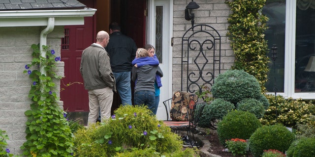 Sept. 28, 2012: Visitors arrive at the home of Jeffrey Giuliano in New Fairfield, Conn. Giuliano fatally shot a masked teenager in self-defense during what appeared to be an attempted burglary early Thursday morning, then discovered that he had killed his son, Tyler, state police said.