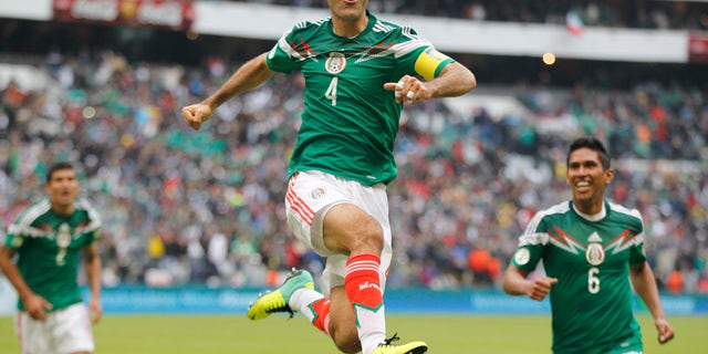 Mexico's Rafael Marquez celebrates after scoring his team's 5th goal during a 2014 World Cup playoff first round match against New Zealand in Mexico City, Wednesday, Nov. 13, 2013. (AP Photo/Eduardo Verdugo)