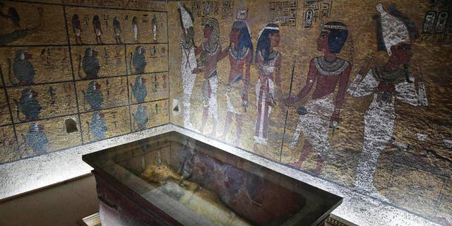 The tomb of King Tutankhamun is displayed in a glass case at the Valley of the Kings in Luxor, Egypt, Tuesday, Sept. 29, 2015.