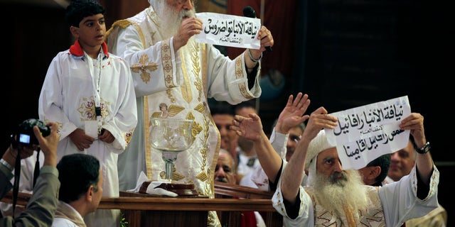 Coptic Christians in Egypt, led by acting Coptic Pope Pachomios, center, say the nation doesn't do enough to protect them from discrimination inside and outside of the nation's borders. (AP)