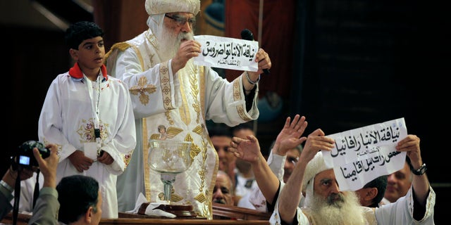 Coptic Christians in Egypt, led by acting Coptic Pope Pachomios, center, say the nation doesn't do enough to protect them from discrimination inside and outside of the nation's borders. (AP)
