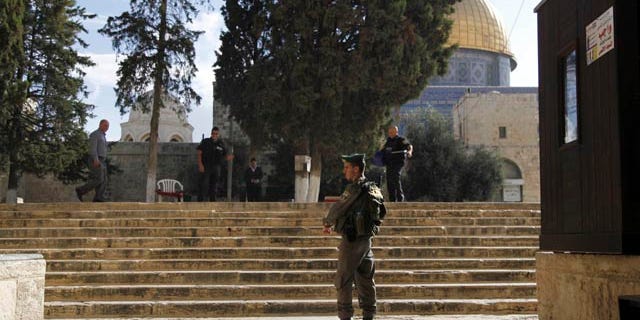 Oct. 8, 2015: Israeli police stand guard at the entrance to the Al-Aqsa compound in Jerusalem's Old City. (AP Photo/Mahmoud Illean)