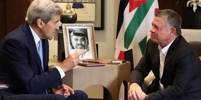 Jordanian King Abdullah II, right, meets with U.S. Secretary of State John Kerry at the Royal Palace in Amman Jordan, Saturday, Oct. 24 2015. Kerry said Saturday that Israel and Jordan have agreed on steps aimed at reducing tensions at a holy site in Jerusalem that have fanned Israeli-Palestinian violence. (AP Photo/Raad Adayleh)