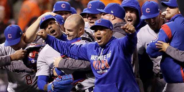 Aroldis Chapman, David Ross and teammates celebrate in San Francisco, Tuesday, Oct. 11, 2016.