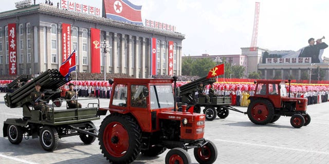 September 9, 2013: Tractors pull artillery through Kim Il Sung Square during a military parade to mark the 65th anniversary of North Korea's founding in Pyongyang.