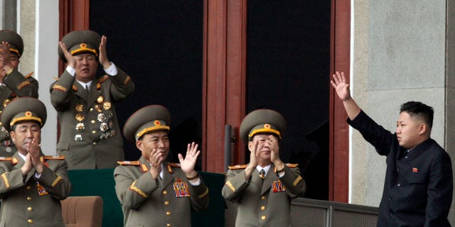 April 14, 2012: North Korean leader Kim Jong Un, left waves as North Korean military officers clap in a stadium in Pyongyang during a mass meeting called by the Central Committee of North Korea's ruling party on Saturday.