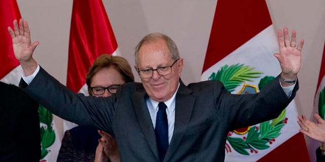 Pedro Pablo Kuczynski acknowledges the crowd at the end of a news conference in Lima, Peru, June 9, 2016.
