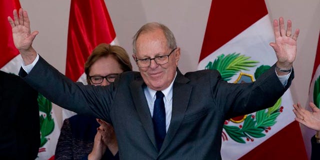Pedro Pablo Kuczynski acknowledges the crowd at the end of a news conference in Lima, Peru, June 9, 2016.