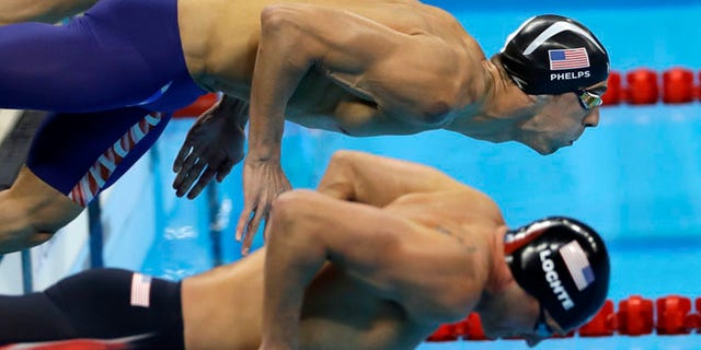 United States' Michael Phelps, top, and United States' Ryan Lochte compete in a semifinal of the men's 200-meter individual medley during the swimming competitions at the 2016 Summer Olympics, Wednesday, Aug. 10, 2016, in Rio de Janeiro, Brazil. (AP Photo/Matt Slocum)