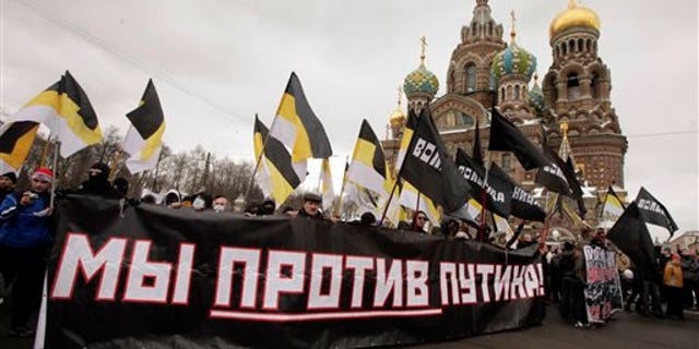 Feb. 25: Protesters attend a massive protest rally against Prime Minister Vladimir Putin's rule in St. Petersburg, Russia, Saturday. The poster reads: 'We against Putin.'
