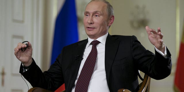 September 3, 2013: Russian President Vladimir Putin gestures while speaking to John Daniszewski, the Associated Press's Senior Managing Editor for International News, during an AP interview at Putin's Novo-Ogaryovo residence outside Moscow. (AP Photo)