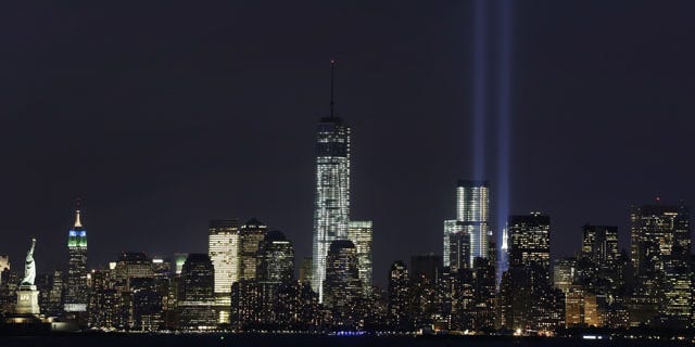 September 9, 2013: The Tribute in Light rises above the lower Manhattan skyline and One World Trade Center, center, in a test of the memorial light display in New York. The twin beams of light will also appear Wednesday, Sept. 11, twelve years after the terrorist attacks of Sept. 11, 2001. (AP Photo)