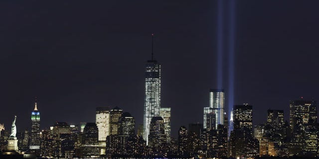 September 9, 2013: The Tribute in Light rises above the lower Manhattan skyline and One World Trade Center, center, in a test of the memorial light display in New York. The twin beams of light will also appear Wednesday, Sept. 11, twelve years after the terrorist attacks of Sept. 11, 2001. (AP Photo)