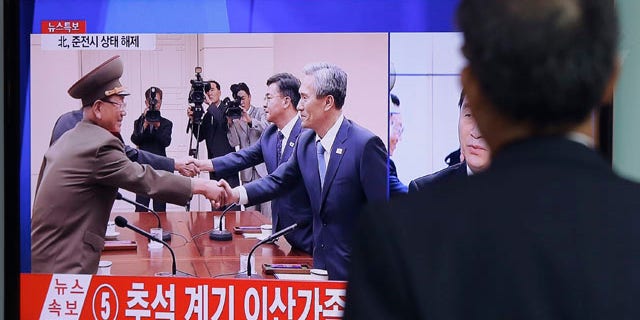Aug. 25, 2015: A man at the Seoul Railway Station watches a TV news program reporting South Korea and North Korea reached an agreement. After 40-plus-hours of talks, the two Koreas on Tuesday pulled back from the brink with an accord that allows both sides to save face and avert the bloodshed they've been threatening each other with for weeks. (AP Photo/Ahn Young-joon)