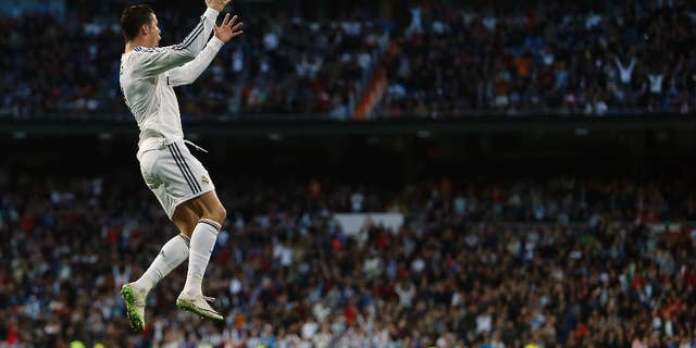 Real's Cristiano Ronaldo celebrates his goal during a Spanish La Liga soccer match between Real Madrid and Levante at the Santiago Bernabeu stadium in Madrid, Spain, Sunday, March 9, 2014. (AP Photo/Andres Kudacki)