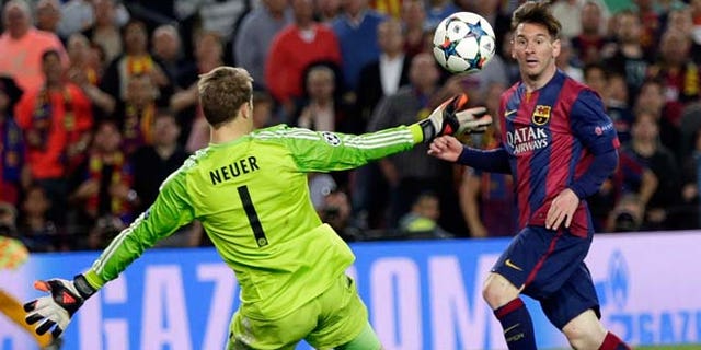 Barcelona's Lionel Messi, right, scores his second goal past Bayern's goalkeeper Manuel Neuer during the Champions League semifinal first leg soccer match between Barcelona and Bayern Munich at the Camp Nou stadium in Barcelona, Spain, Wednesday, May 6, 2015. (AP Photo/Emilio Morenatti)