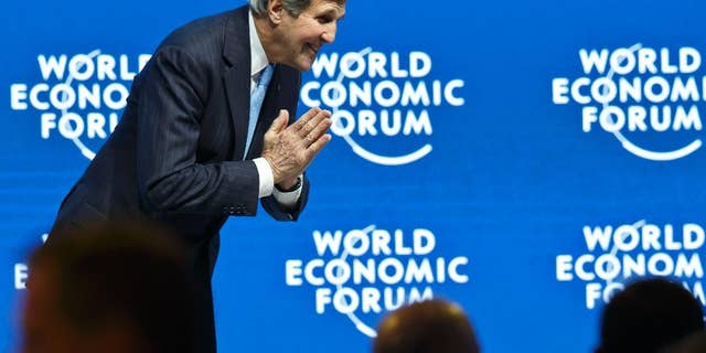 US Presidential Special Envoy for Climate John Kerry bows to someone after his speech during a roundtable discussion at the World Economic Forum, in Davos, Switzerland, Friday, Jan. 23, 2015. (AP Photo/ Michael Euler)