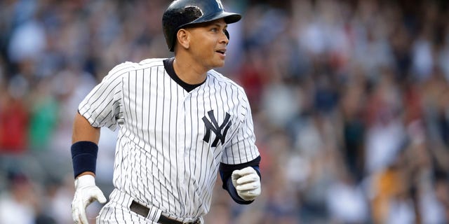 New York Yankees' Alex Rodriguez watches his home run, his 3,000th career hit, during the first inning of a baseball game against the Detroit Tigers on Friday, June 19, 2015, in New York. (AP Photo/Frank Franklin II)