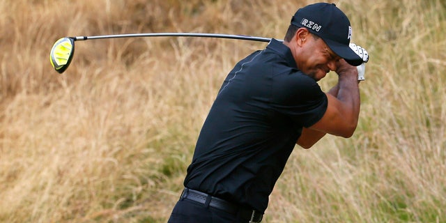 June 18, 2015: Tiger Woods reacts to his tee shot on the eighth hole during the first round of the U.S. Open golf tournament at Chambers Bay in University Place, Wash. (AP Photo/Matt York)