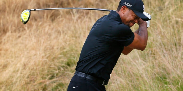 June 18, 2015: Tiger Woods reacts to his tee shot on the eighth hole during the first round of the U.S. Open golf tournament at Chambers Bay in University Place, Wash. (AP Photo/Matt York)