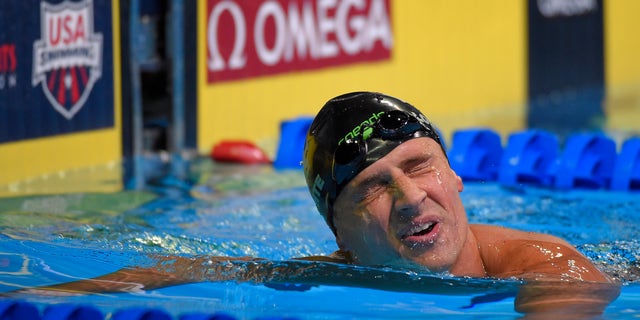 Ryan Lochte reacts after swimming in the men's 200-meter freestyle final at the U.S. Olympic swimming trials, Tuesday, June 28, 2016, in Omaha, Neb. (AP Photo/Mark J. Terrill)