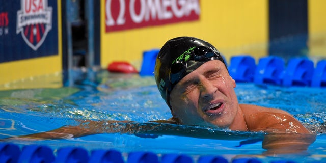 Ryan Lochte reacts after swimming in the men's 200-meter freestyle final at the U.S. Olympic swimming trials, Tuesday, June 28, 2016, in Omaha, Neb. (AP Photo/Mark J. Terrill)