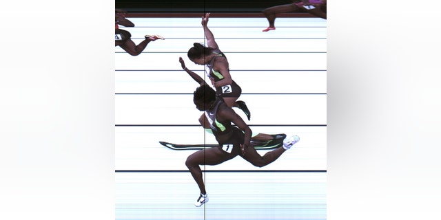 June 23, 2012: This photo provided by USA Track & Field shows the third-place finish of the women's 100-meter final from a photo-finish camera, shot at 3,000-frames-per-second, during the U.S. Olympic Track and Field Trials in Eugene, Ore.