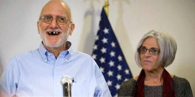 Dec. 17, 2014: Alan Gross, accompanied by his wife, Judy, speaks during a news conference at his lawyer's office in Washington. Gross was released from Cuba after five years in a Cuban prison. (AP Photo/Pablo Martinez Monsivais)
